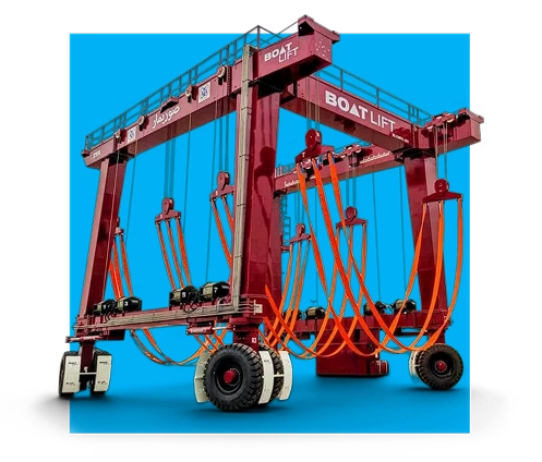 Red gantry crane with multiple orange spreader bars and lifting straps against bright blue background, studio product shot